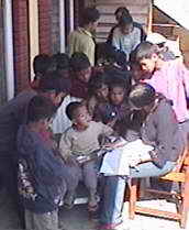 Examination of a boy of four - and many on-lookers